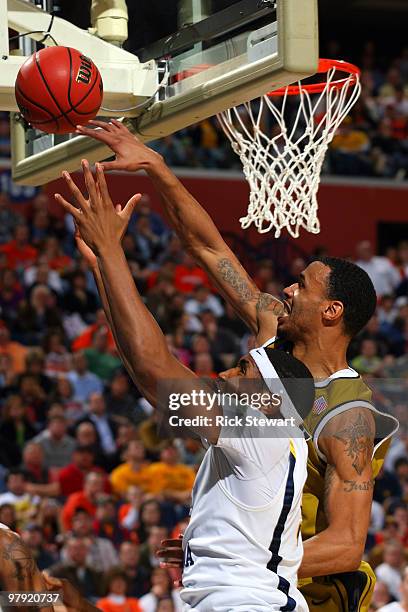 Keith Ramsey of the Missouri Tigers goes up against Kevin Jones of the West Virginia Mountaineers during the second round of the 2010 NCAA men's...