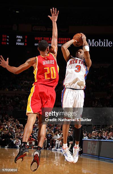 Tracy McGrady of the New York Knicks shoots against Jared Jeffries of the Houston Rockets on March 21, 2010 at Madison Square Garden in New York...
