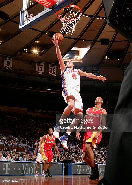 Danilo Gallinari of the New York Knicks shoots against Shane Battier of the Houston Rockets on March 21, 2010 at Madison Square Garden in New York...
