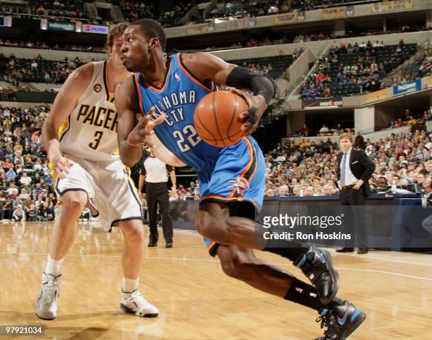 Jeff Green of the Oklahoma City Thunder drives on Troy Murphy of the Indiana Pacers at Conseco Fieldhouse on March 21, 2010 in Indianapolis, Indiana....