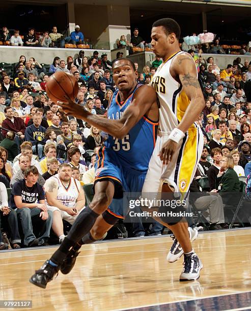 Kevin Durant of the Oklahoma City Thunder drives on Brandon Rush of the Indiana Pacers at Conseco Fieldhouse on March 21, 2010 in Indianapolis,...