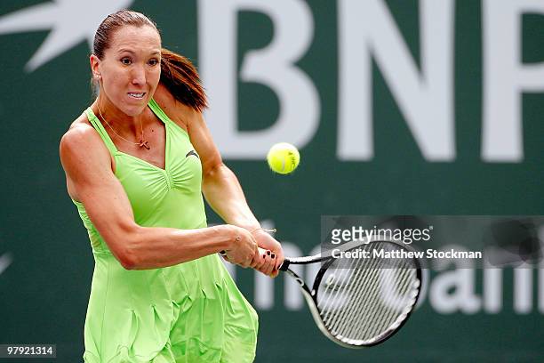 Jelena Jankovic of Serbia returns a shot to Caroline Wozniacki of Denmark the final of the BNP Paribas Open on March 21, 2010 at the Indian Wells...