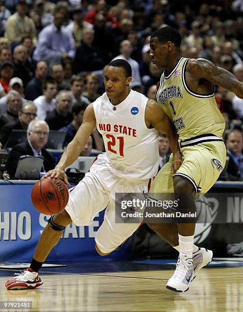 Evan Turner of the Ohio State Buckeyes drives on Iman Shumpert of the Georgia Tech Yellow Jackets in the second half during the second round of the...