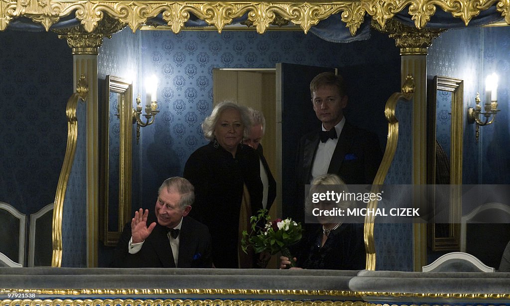 Britain's Prince Charles (1st L) waves a