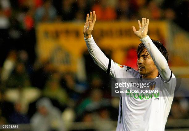 Valencia's midfielder David Silva celebrates after scoring a goal during their league football match against Almeria at Mestalla Stadium in Valencia...