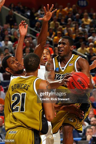 Tiller of the Missouri Tigers goes to the hoop against Devin Ebanks of the West Virginia Mountaineers during the second round of the 2010 NCAA men's...