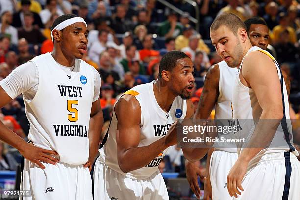 Da'Sean Butler of the West Virginia Mountaineers reacts against the Missouri Tigers as Kevin Jones and Cam Thoroughman look on during the second...