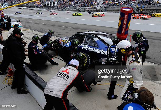 Robby Gordon, driver of the Warner Music Nashville Toyota, pits during the NASCAR Sprint Cup Series Food City 500 at Bristol Motor Speedway on March...