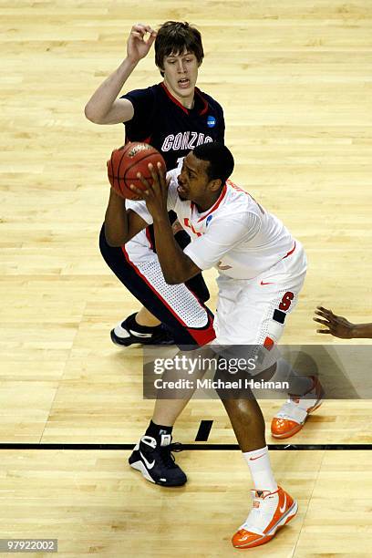 Kelly Olynyk of the Gonzaga Bulldogs defends against Kris Joseph of the Syracuse Orange during the second round of the 2010 NCAA men's basketball...