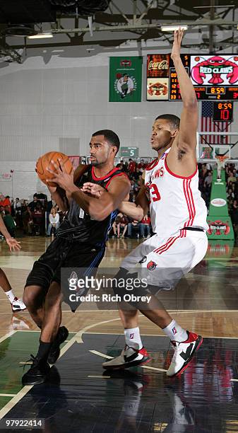 Tre Whitted of th Springfield Armor looks to pass while being guarded in the paint by Morris Almond of the Maine Red Claws during the game March 21,...