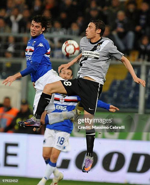 Andrea Poli of UC Sampdoria goes up for the ball against Claudio Marchisio of Juventus FC during the Serie A match between UC Sampdoria and Juventus...