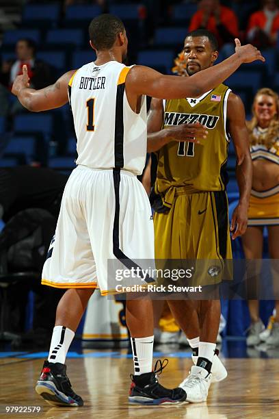 Da'Sean Butler of the West Virginia Mountaineers greets Zaire Taylor of the Missouri Tigers during the second round of the 2010 NCAA men's basketball...