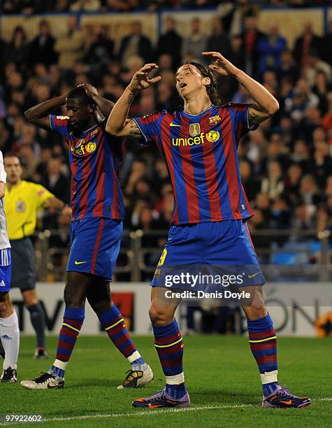 Zlatan Ibrahimovic and Toure Yaya of Barcelona react during the La Liga match between Real Zaragoza and Barcelona at La Romareda stadium on March 21,...