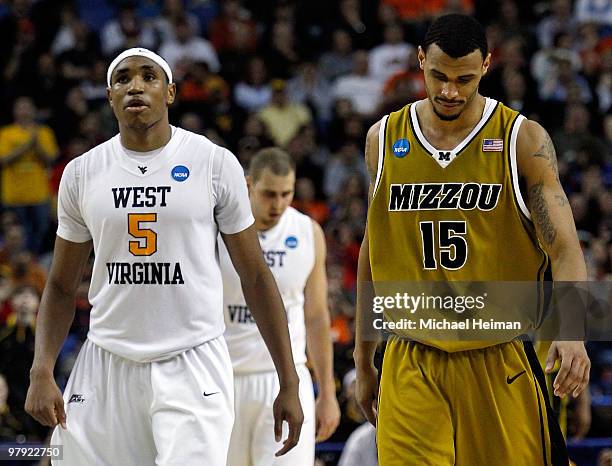 Keith Ramsey of the Missouri Tigers and Kevin Jones of the West Virginia Mountaineers walk down court during the second round of the 2010 NCAA men's...