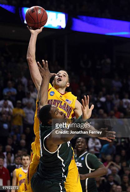 Greivis Vasquez of the Maryland Terrapins shoots over Delvon Roe of the Michigan State Spartans during the second round of the 2010 NCAA men's...