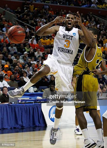 Kim English of the Missouri Tigers fouls Devin Ebanks of the West Virginia Mountaineers during the second round of the 2010 NCAA men's basketball...