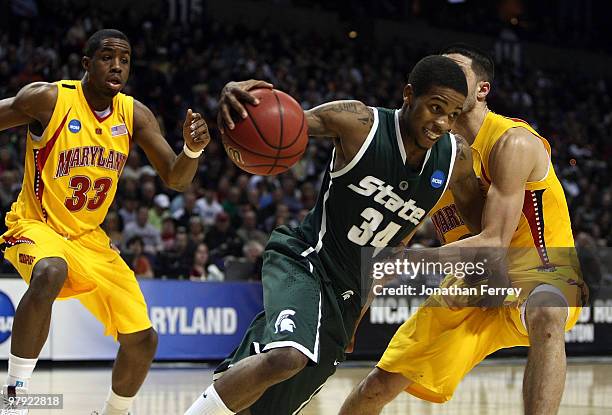 Korie Lucious of the Michigan State Spartans drives against Greivis Vasquez of the Maryland Terrapins during the second round of the 2010 NCAA men's...
