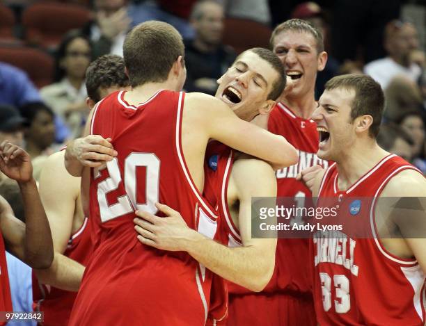 Ryan Wittman, Jon Jaques, Jeff Foote and Alex Taylor of the Cornell Big Red celebrate after defeating the Wisconsin Badgers during the second round...