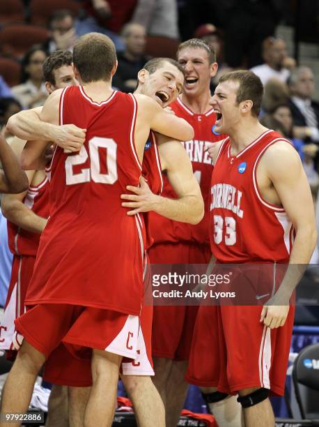 Ryan Wittman, Jon Jaques, Jeff Foote and Alex Taylor of the Cornell Big Red celebrate after defeating the Wisconsin Badgers during the second round...