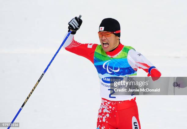 Yoshihiro Nitta of Japan celebrates as he crosses the line to win gold in the Men's 1km Standing Cross-Country Sprint Final during Day 10 of the 2010...