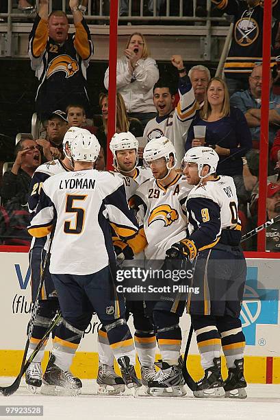 Tim Connolly of the Buffalo Sabres celebrates with teammates after scoring a goal against the Carolina Hurricanes during their NHL game on March 21,...