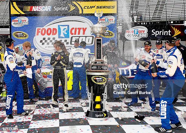 Jimmie Johnson , driver of the Lowe's Chevrolet, celebrates with crew chief Chad Knaus in Victory Lane after winning the NASCAR Sprint Cup Series...