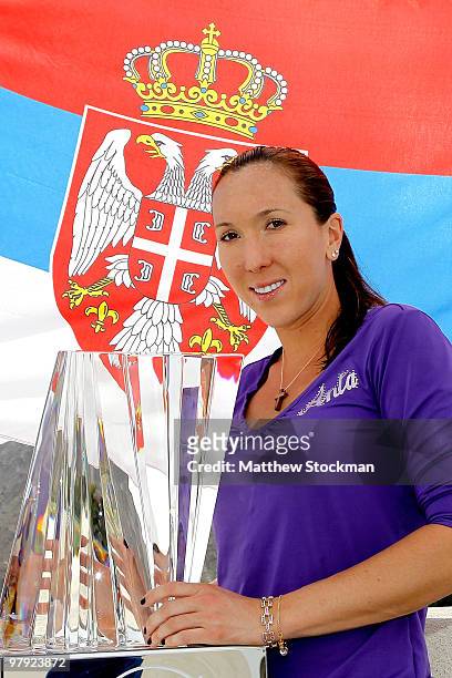 Jelena Jankovic of Serbia poses for photographers after defeating Caroline Wozniacki of Denmark during the final of the BNP Paribas Open on March 21,...