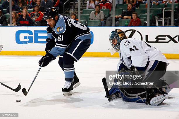 Cory Stillman of the Florida Panthers shoots and scores a goal against Mike Smith of the Tampa Bay Lightning at the BankAtlantic Center on March 21,...