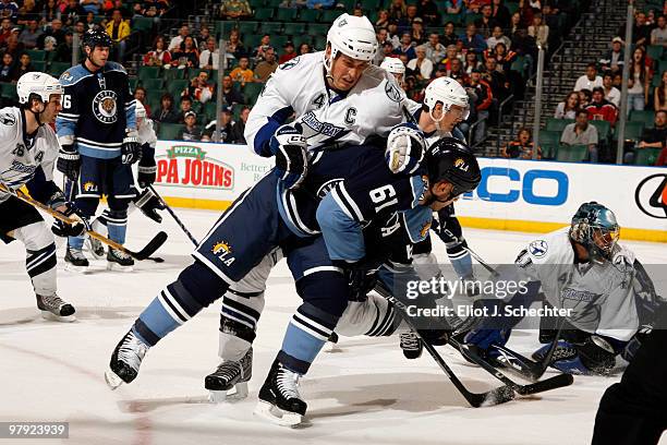 Cory Stillman of the Florida Panthers shoots and scores a goal against Vincent Lecavalier of the Tampa Bay Lightning at the BankAtlantic Center on...