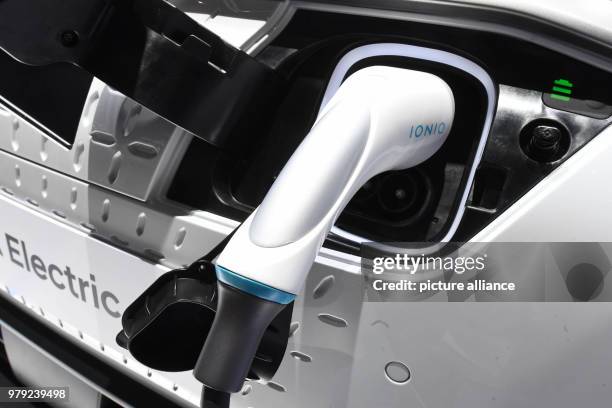 Dpatop - A charging plug is plugged into a Hyundai SUV Kona during it's presentationon the first press day of the 2018 Geneva Motor Show in Geneva,...