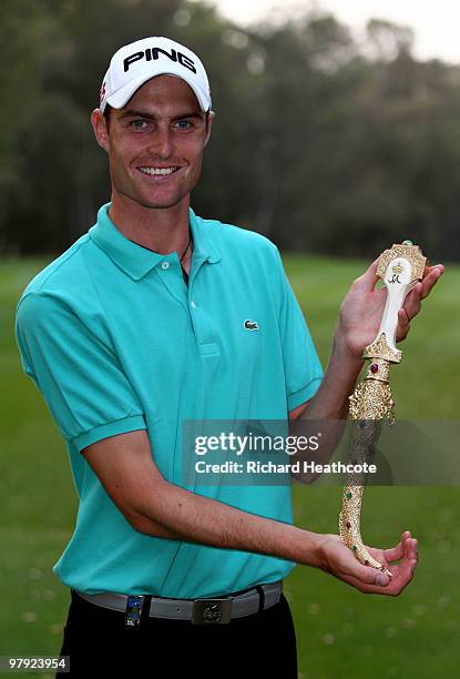 Rhys Davies of Wales poses with the winners trophy after the final round of the Hassan II Golf Trophy at Royal Golf Dar Es Salam on March 21, 2010 in...