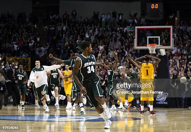 Korie Lucious of the Michigan State Spartans runs down the court after sinking a game winning three point shot at the buzzer to win 85-83 against the...