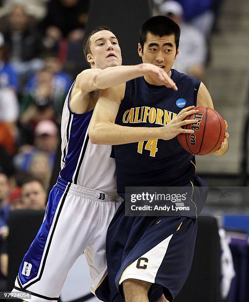 Miles Plumlee of the Duke Blue Devils tries to stop Max Zhang of the California Golden Bears during the second round of the 2010 NCAA men's...