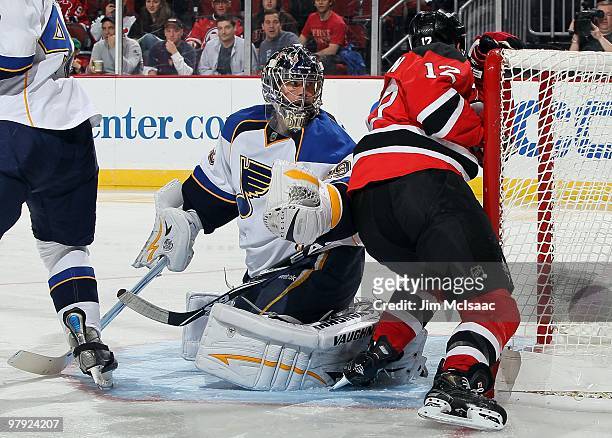 Ty Conklin of the St. Louis Blues defends against the New Jersey Devils at the Prudential Center on March 20, 2010 in Newark, New Jersey. The Blues...