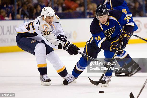 Oshie of the St. Louis Blues looks to get past Jerred Smithson of the Nashville Predators at the Scottrade Center on March 21, 2010 in St. Louis,...