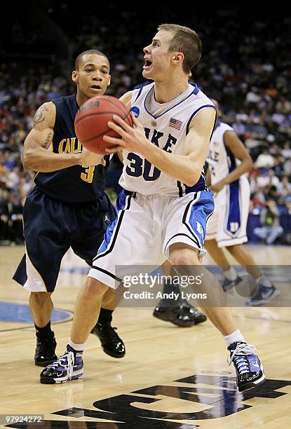 Jon Scheyer of the Duke Blue Devils looks to shoot over Jerome Randle of the California Golden Bears during the second round of the 2010 NCAA men's...