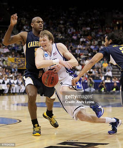 Kyle Singler of the Duke Blue Devils is stripped of the ball by Jorge Gutierrez and Patrick Christopher of the California Golden Bears during the...
