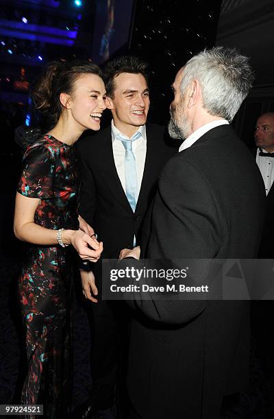 Keira Knightley, Rupert Friend and Jonathan Pryce attend The Laurence Olivier Awards, at the Grosvenor House Hotel on March 21, 2010 in London,...