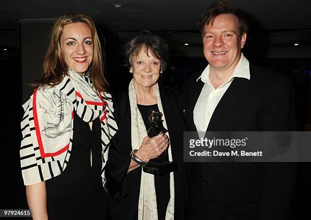 Dame Maggie Smith with Christopher Larkin and Sookie Stephens attend The Laurence Olivier Awards, at the Grosvenor House Hotel on March 21, 2010 in...