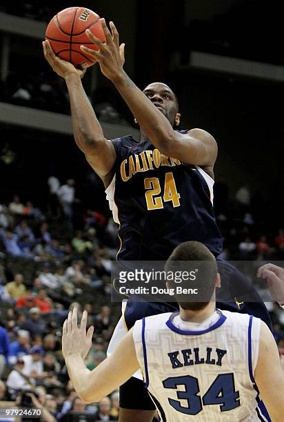 Theo Robertson of the California Golden Bears shoots over Ryan Kelly of the Duke Blue Devils during the second round of the 2010 NCAA men's...