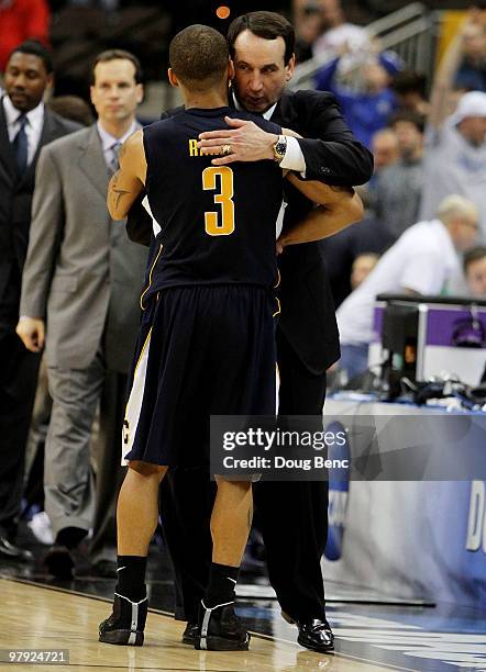 Head coach Mike Krzyzewski of the Duke Blue Devils consoles Jerome Randle of the California Golden Bears during the second round of the 2010 NCAA...