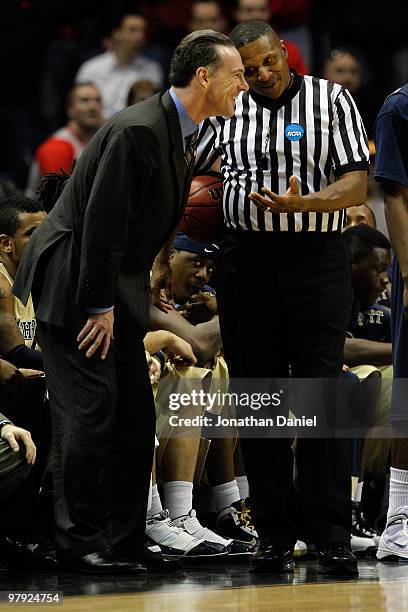 Head coach Jamie Dixon of the Pittsburgh Panthers talks with a referee about a call in the final minute against the Xavier Musketeers during the...