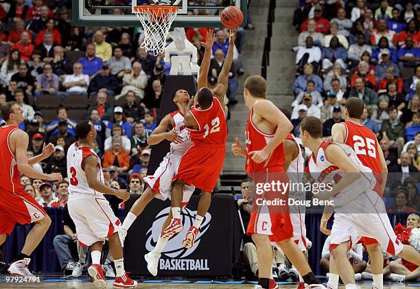 Louis Dale of the Cornell Big Red scores over Ryan Evans of the Wisconsin Badgers during the second round of the 2010 NCAA men's basketball...