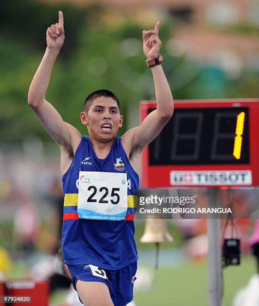 Colombian Javier Pena celebrates after winning the golden medal in the men's 10.000 meters during the IX South American Games in Medellin, Antioquia...