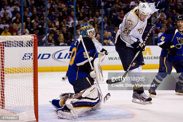 Chris Mason of the St. Louis Blues makes a save against Patric Hornqvist of the Nashville Predators at the Scottrade Center on March 21, 2010 in St....