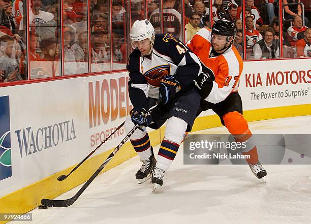 Rich Peverley of the Atlanta Thrashers takes control of the puck in front of Ryan Parent of the Philadelphia Flyers on his way to scoring at the...