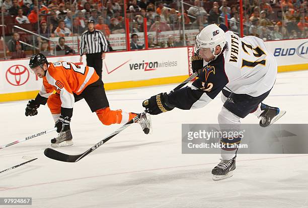 Todd White of the Atlanta Thrashers scores his teams second goal against the Philadelphia Flyers on his way to scoring at the Wachovia Center on...