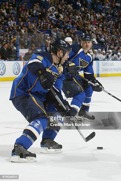 Barret Jackman of the St. Louis Blues handles the puck against the Nashville Predators on March 21, 2010 at Scottrade Center in St. Louis, Missouri.
