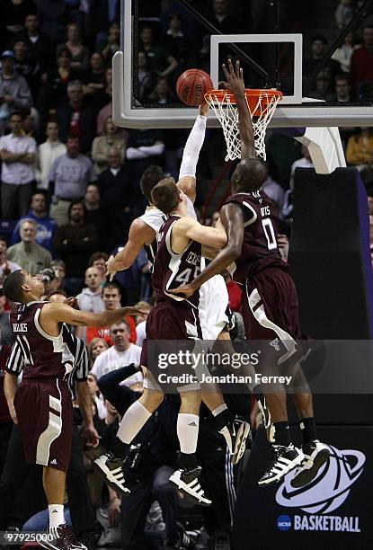 Chris Kramer of the Purdue Boilermakers shoots the game winning basket in overtime to defeat of the Texas A&M Aggies 63-61 during the second round of...