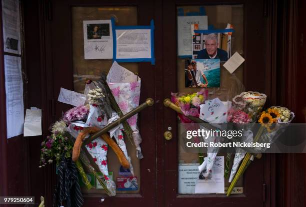 Fowers, notes and photographs left in memory of Anthony Bourdain are displayed at the closed location of Brasserie Les Halles where Bourdain used to...